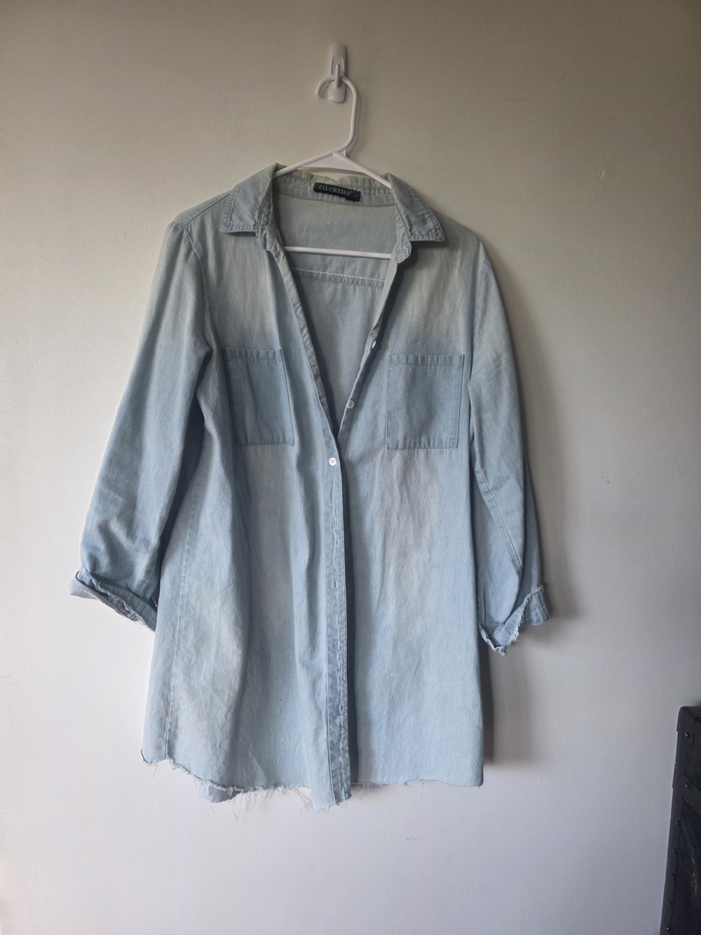 Light Wash Denim Button Up Shirt With A Raw Hem